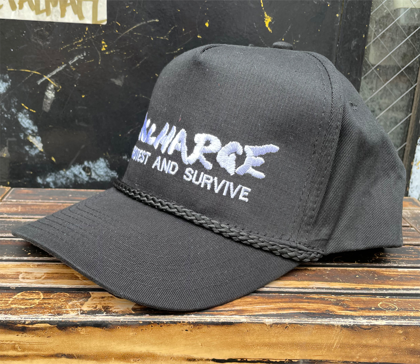DISCHARGE CAP PROTEST AND SURVIVE